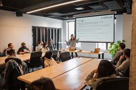 The team gathered around a table during a meeting